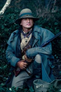 Actor Eugene Brave Rock / Clay Enos for Warner Bros. Entertainment Inc., Ratpac-Dune Entertainment LLC
